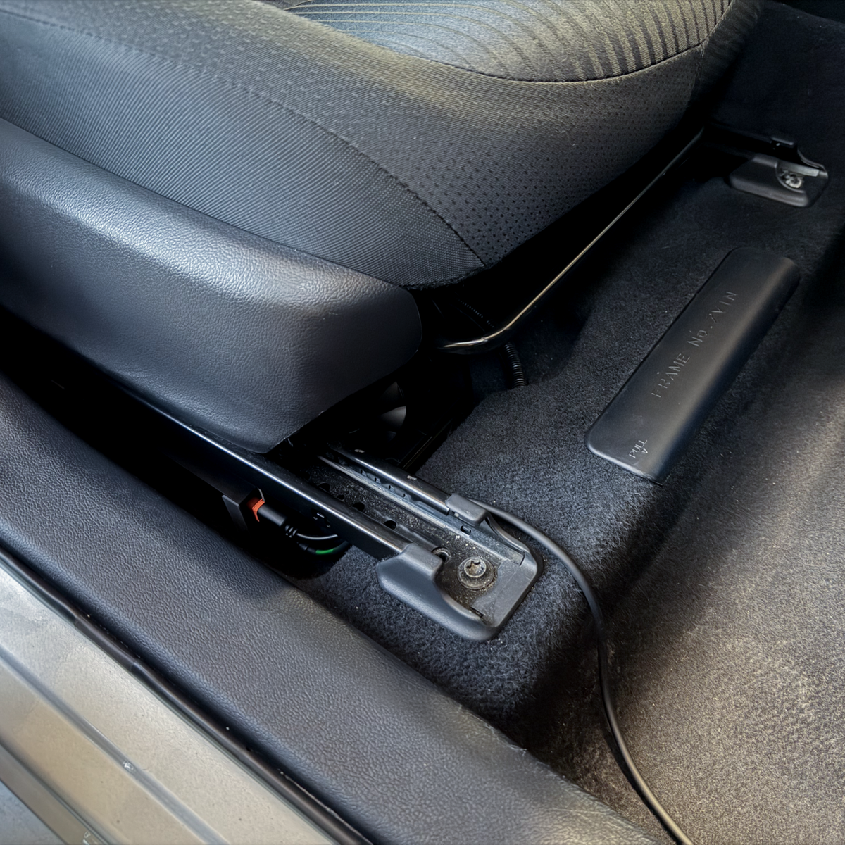 chestnut installed under the passenger seat
